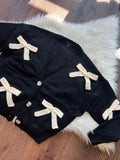 BOW UP BLK CARDI W/IVORY BOWS