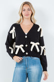 BOW UP BLK CARDI W/IVORY BOWS